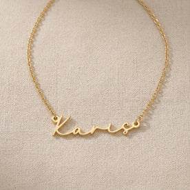 Karis Name Necklace — Nameplate Flatlay
